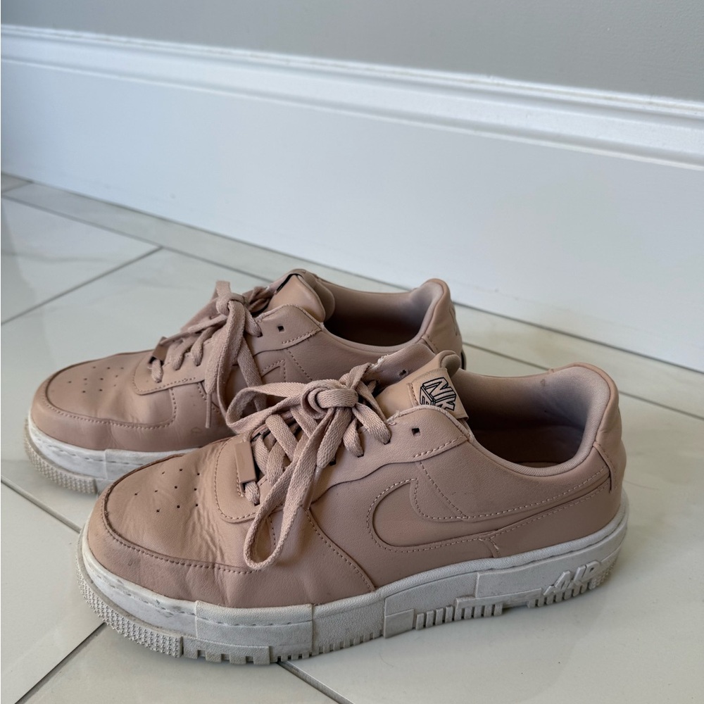 Light pink women’s Nike Air Force Ones Sneakers